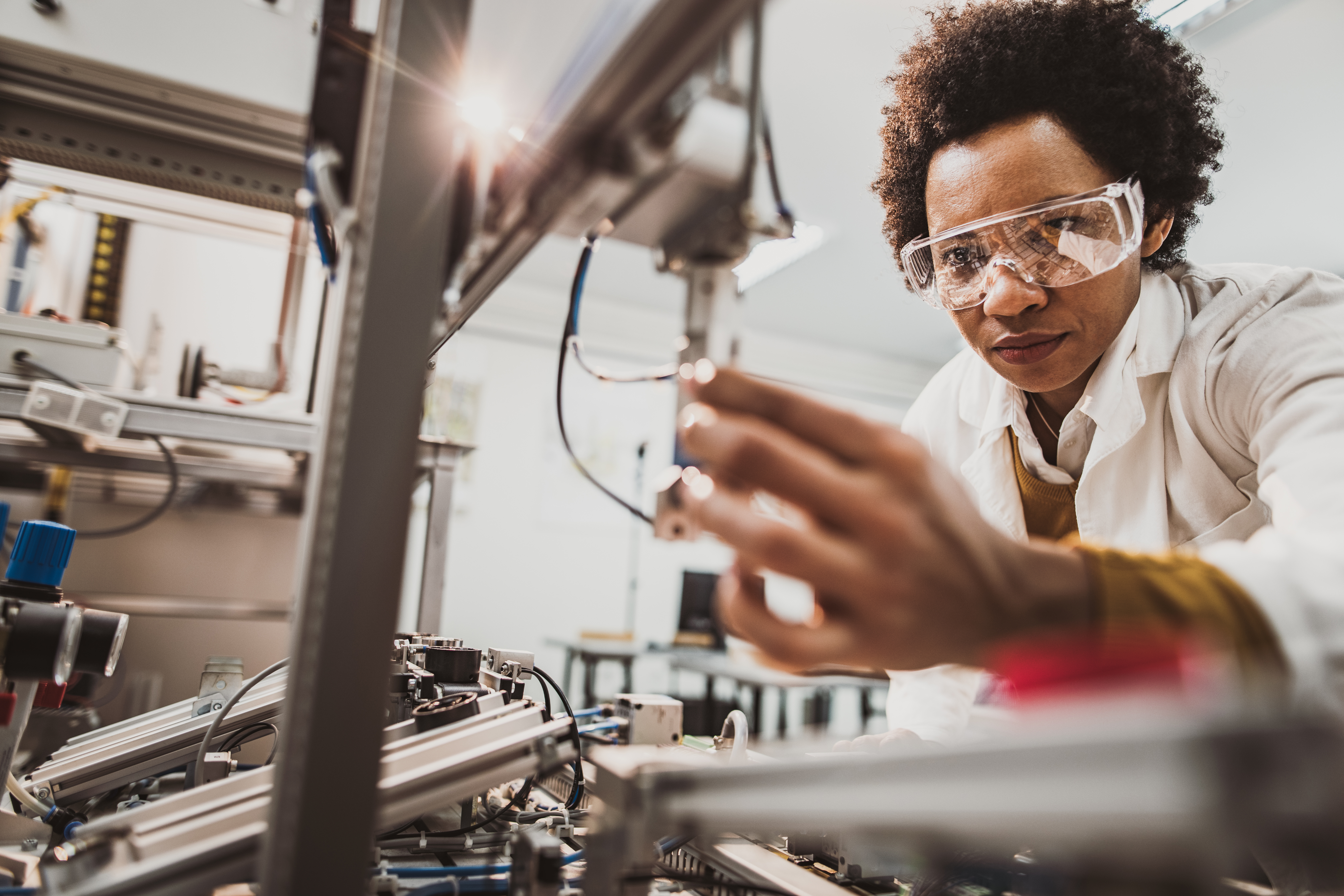 Woman checking manufacturing quality of product