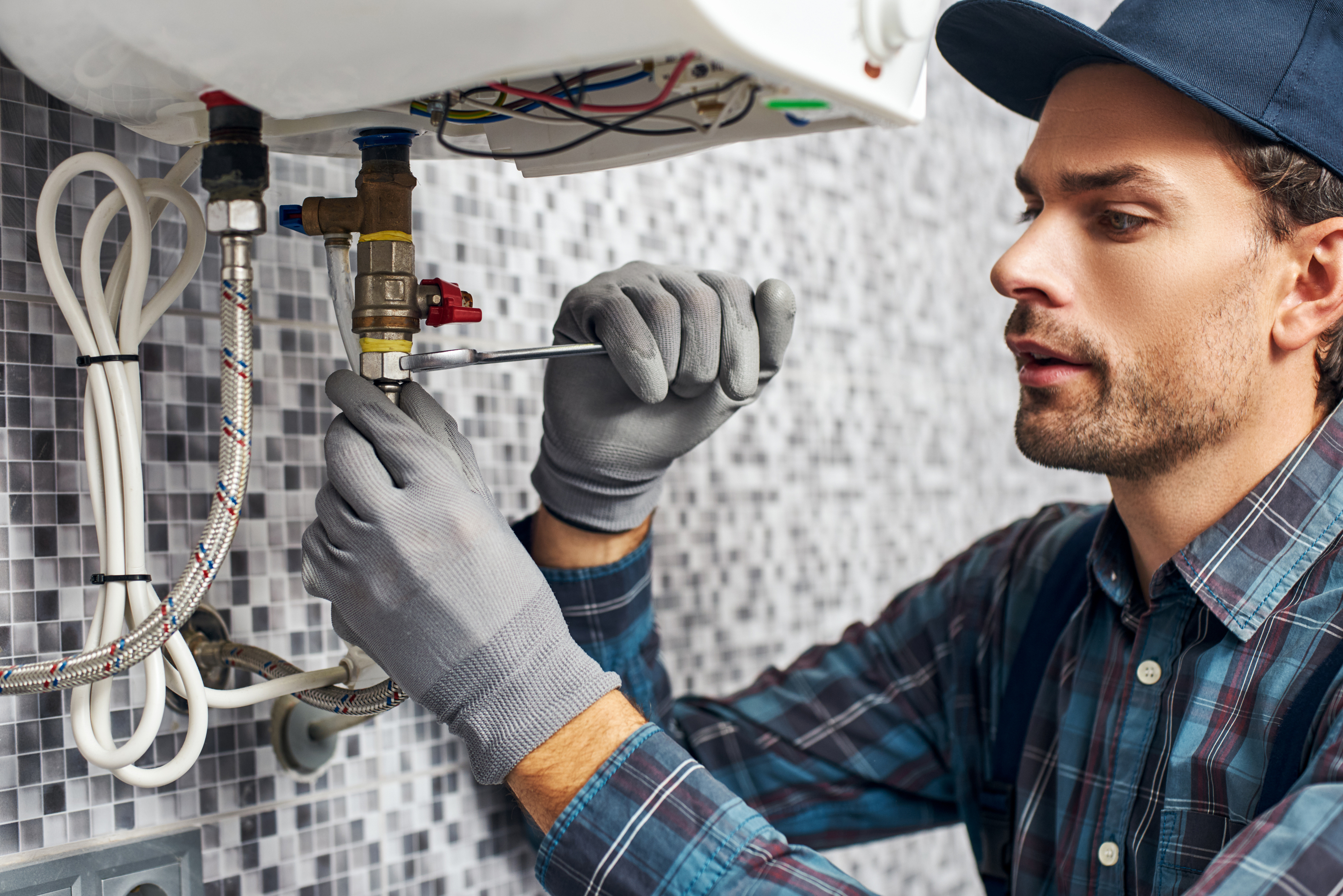 Plumber fixing a sink