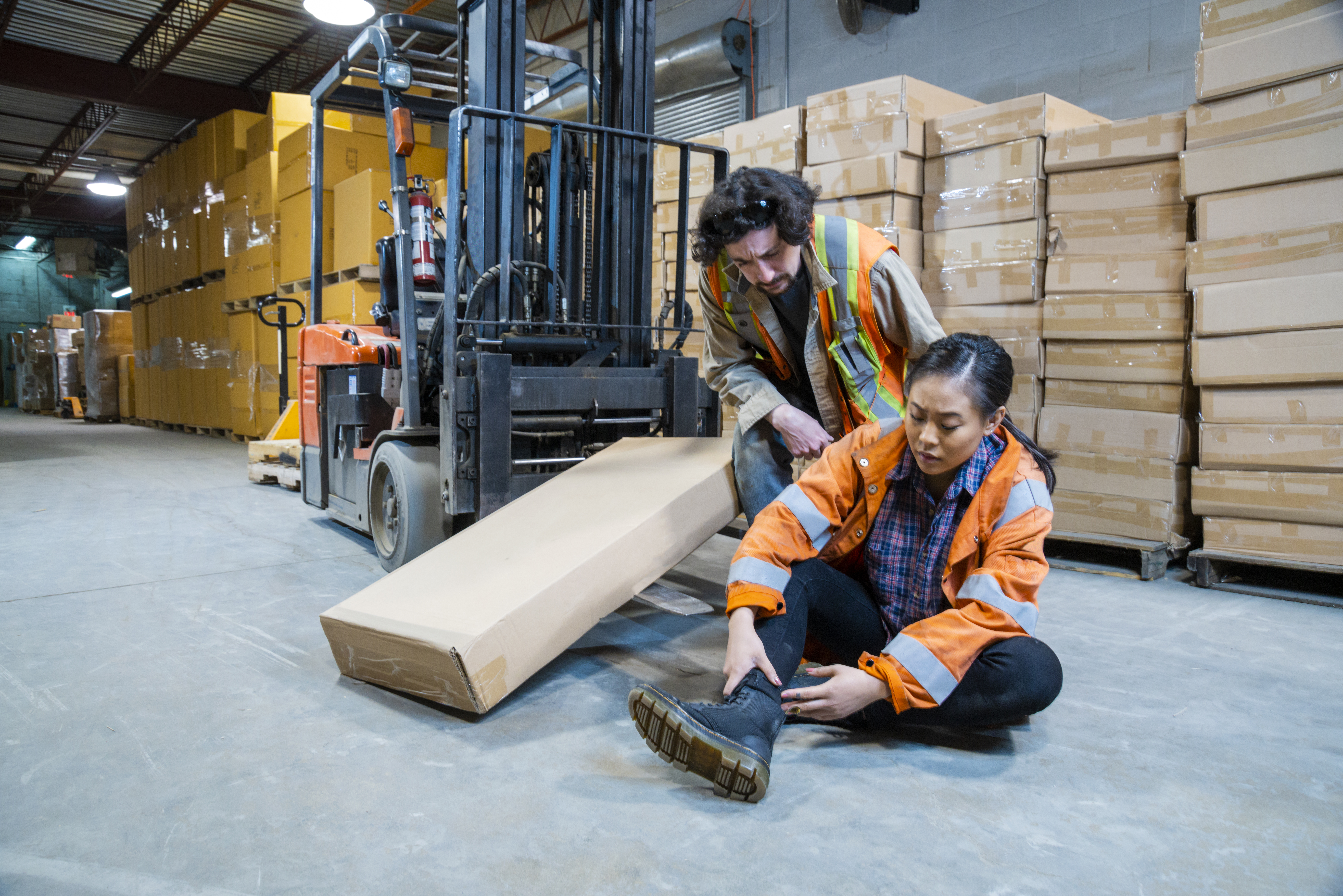 Co-worker checking on a hurt co-worker