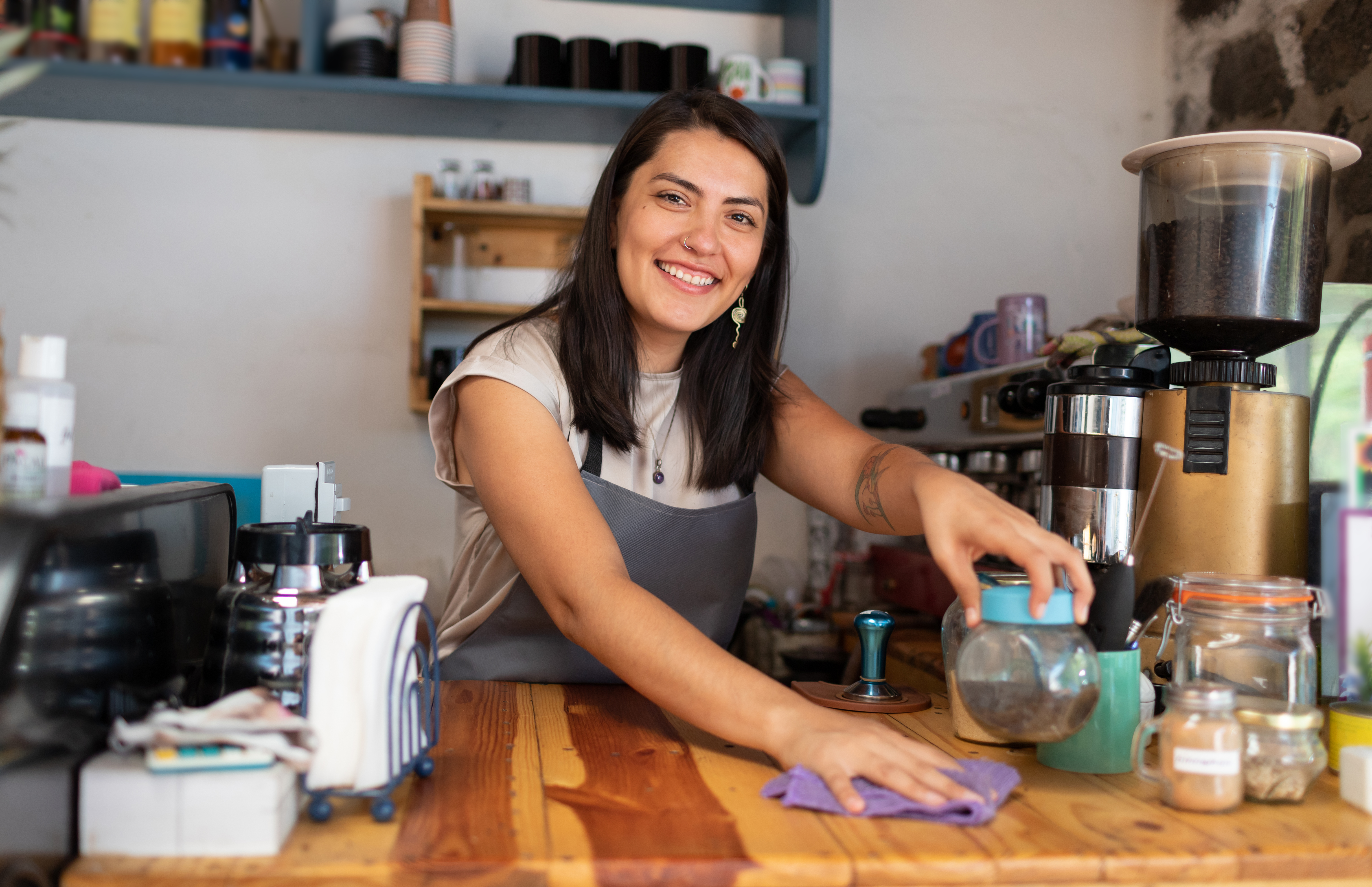 Barista cleaning counter