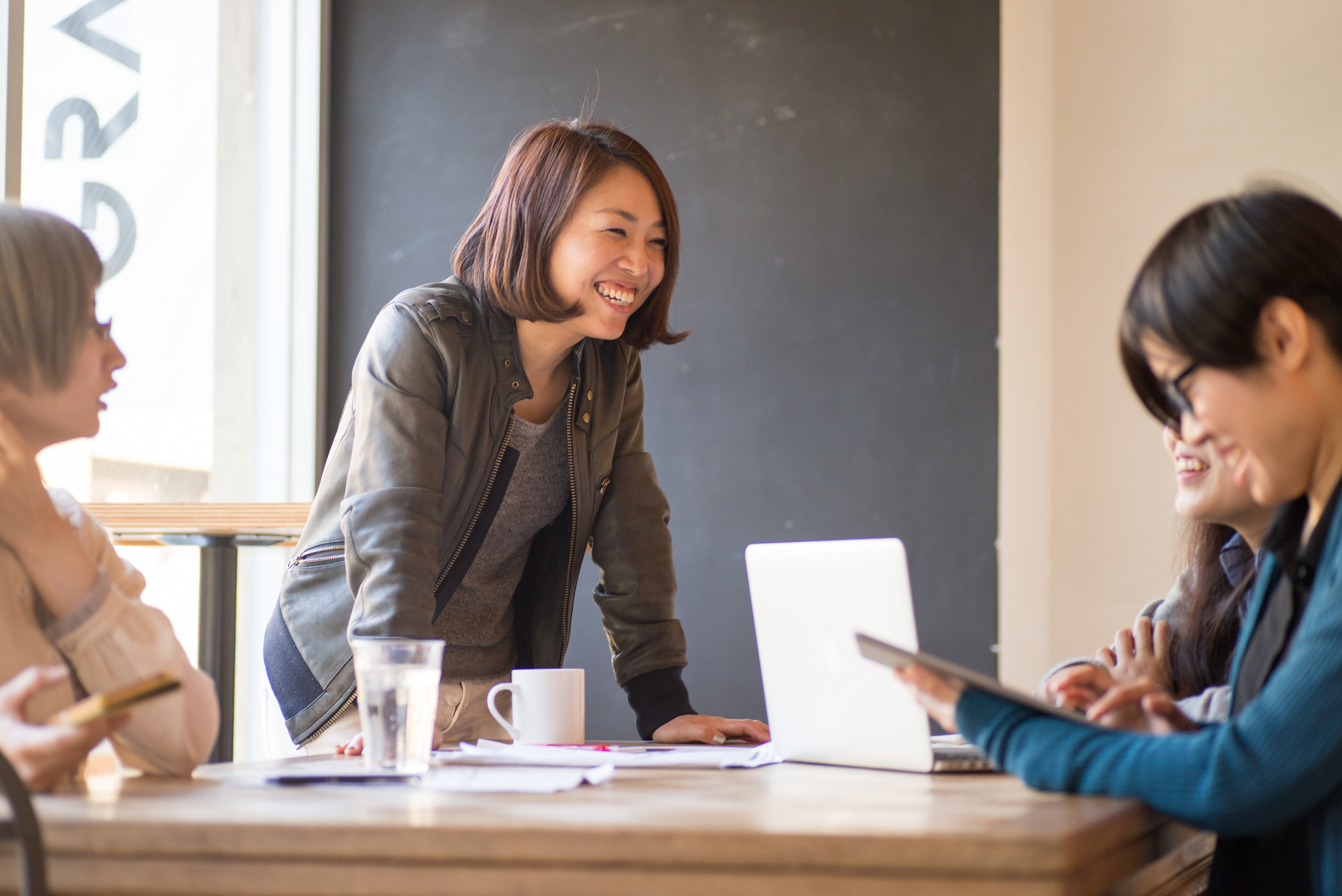 Group smiling at a conference table