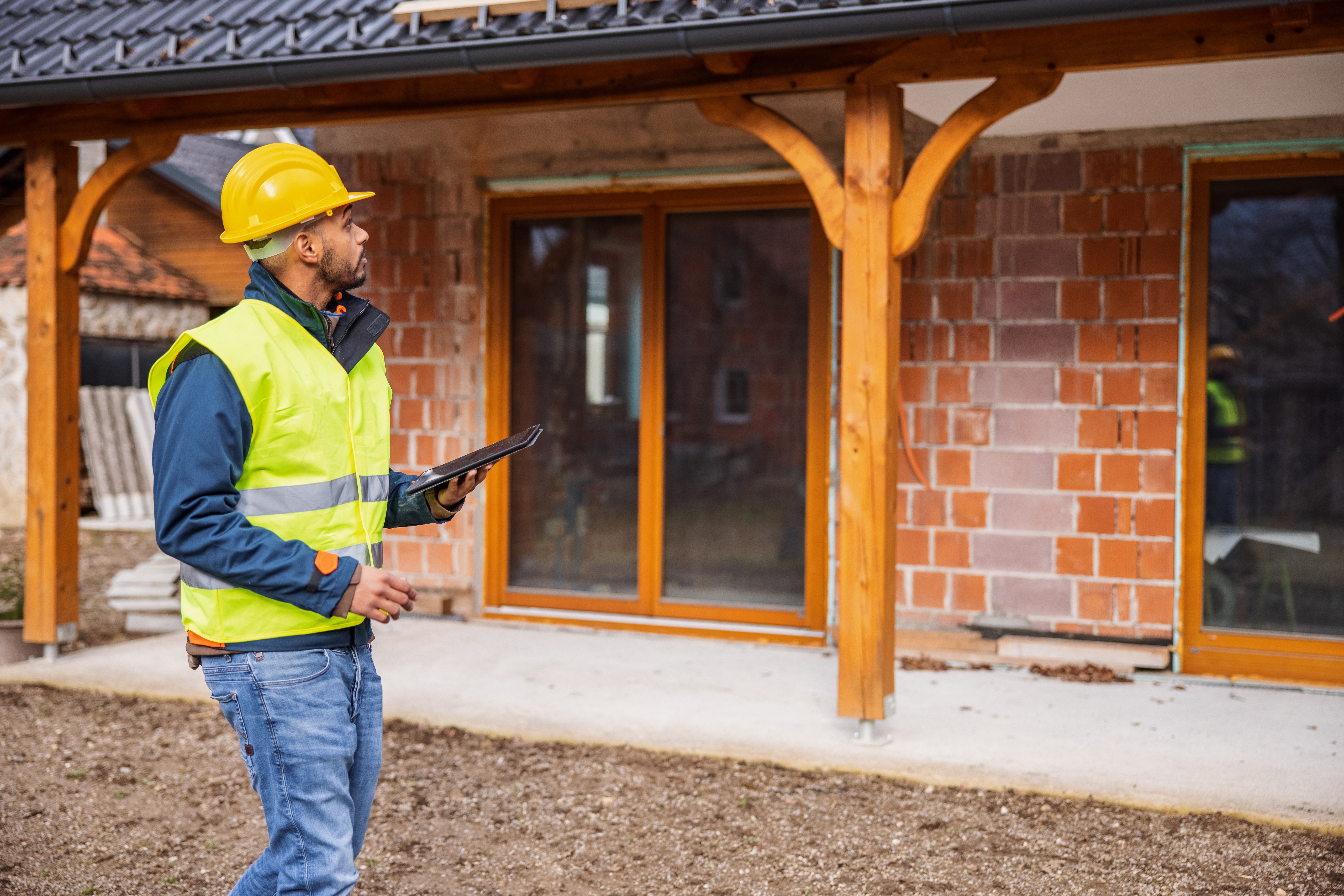 Inspector looking at the exterior of a building